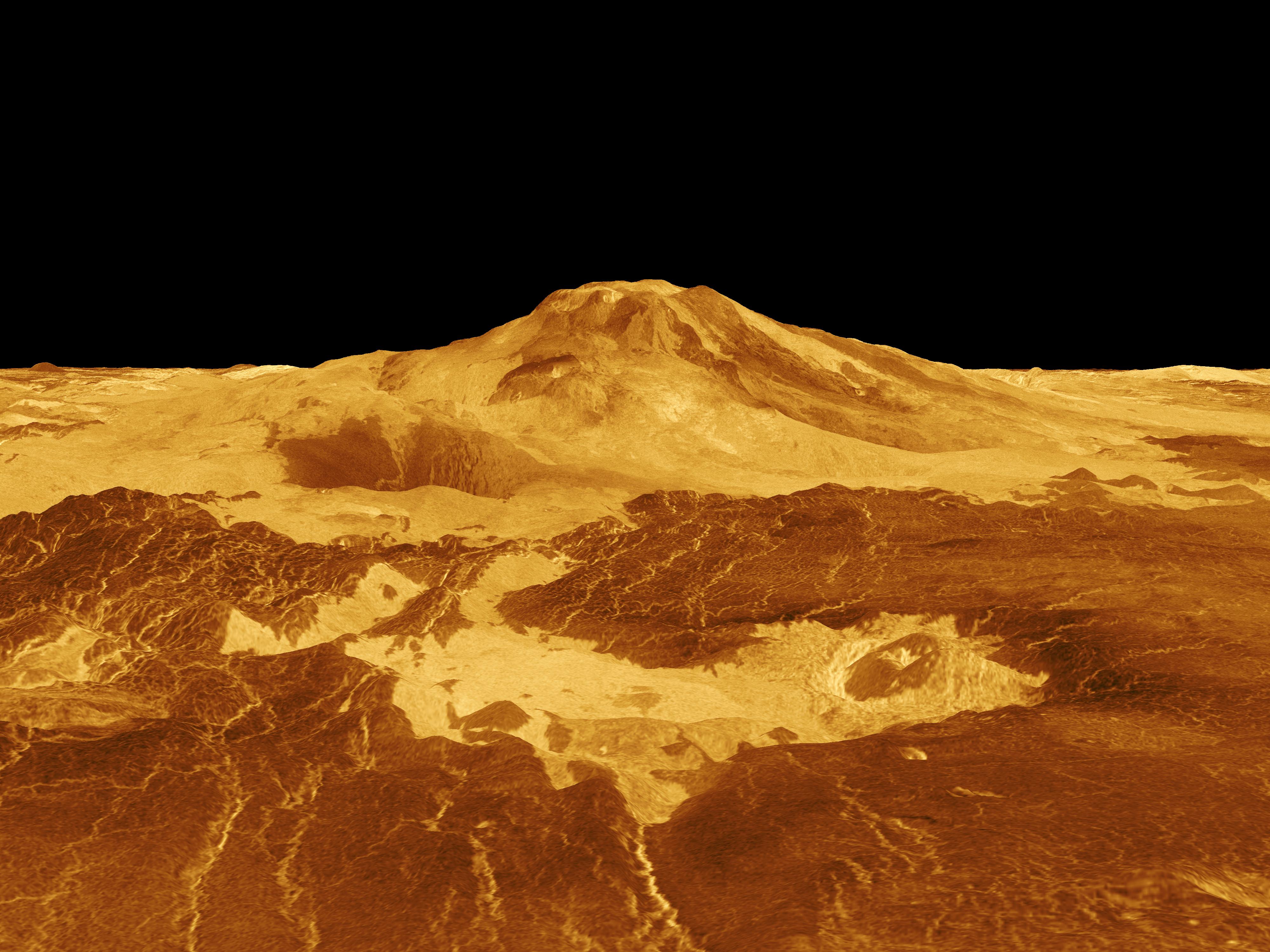 Computer-generated image of the Maat Mons volcano on Venus' surface. This yellow and gold photo with black background of Maat Mons reaches up to 8 km (4.9 miles) above Venus’ average surface.