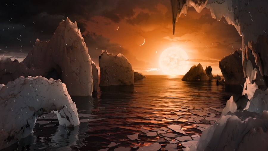 Vue d'artiste pour nous permettre d'imaginer à quoi pourrait ressembler la surface de l'exoplanète TRAPPIST-1f: au-dessus d'un océan, on voit l'étoile qui apparaît grosse car elle est très proche, et rouge car elle est peu chaude. D'autres planètes voisines sont visibles dans le ciel !
image NASA